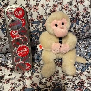 Vintage Coca-Cola albino monkey stuffed animal w/long Coca Cola bottle cap tin
